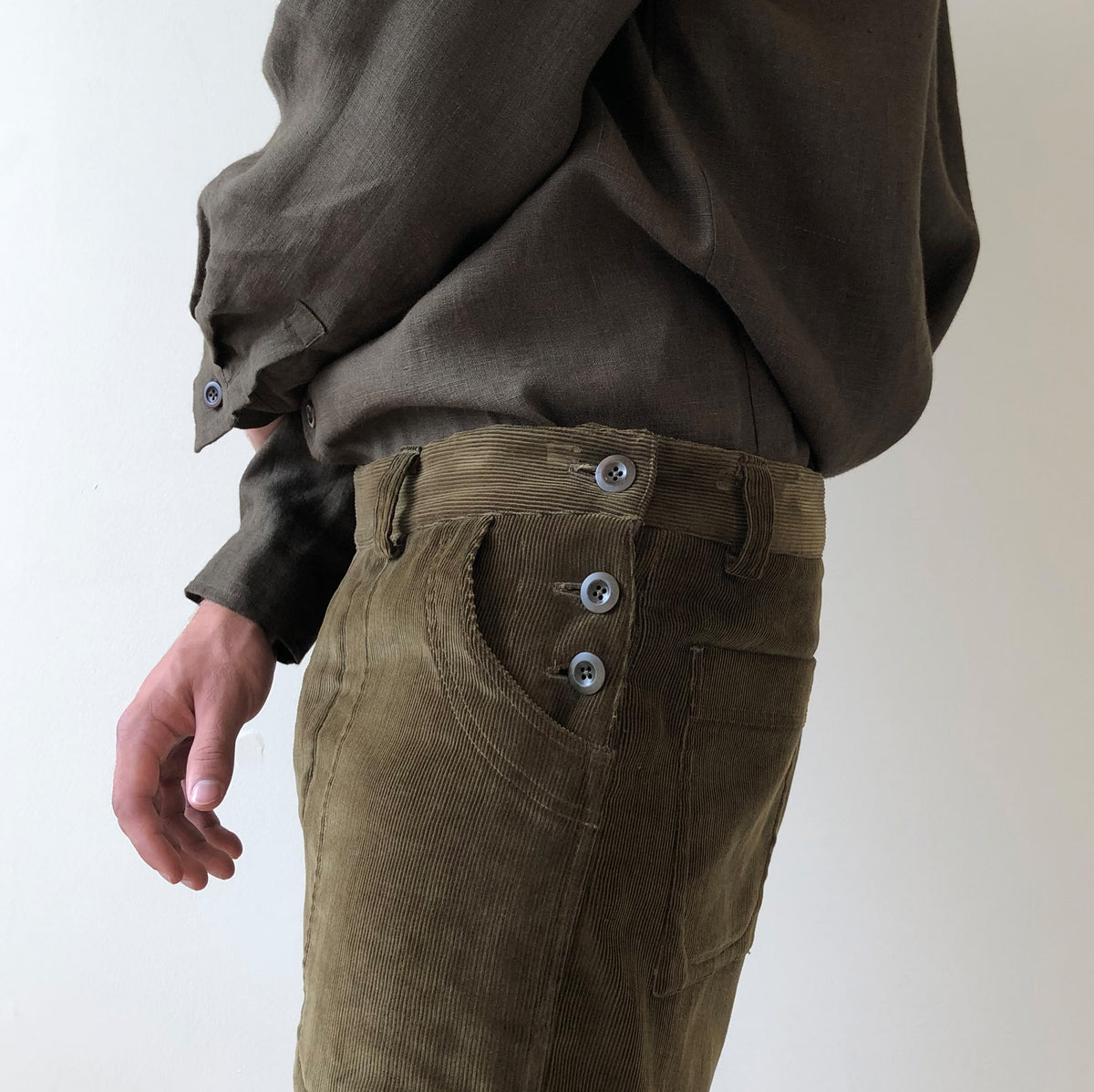 Side button trousers in olive cord