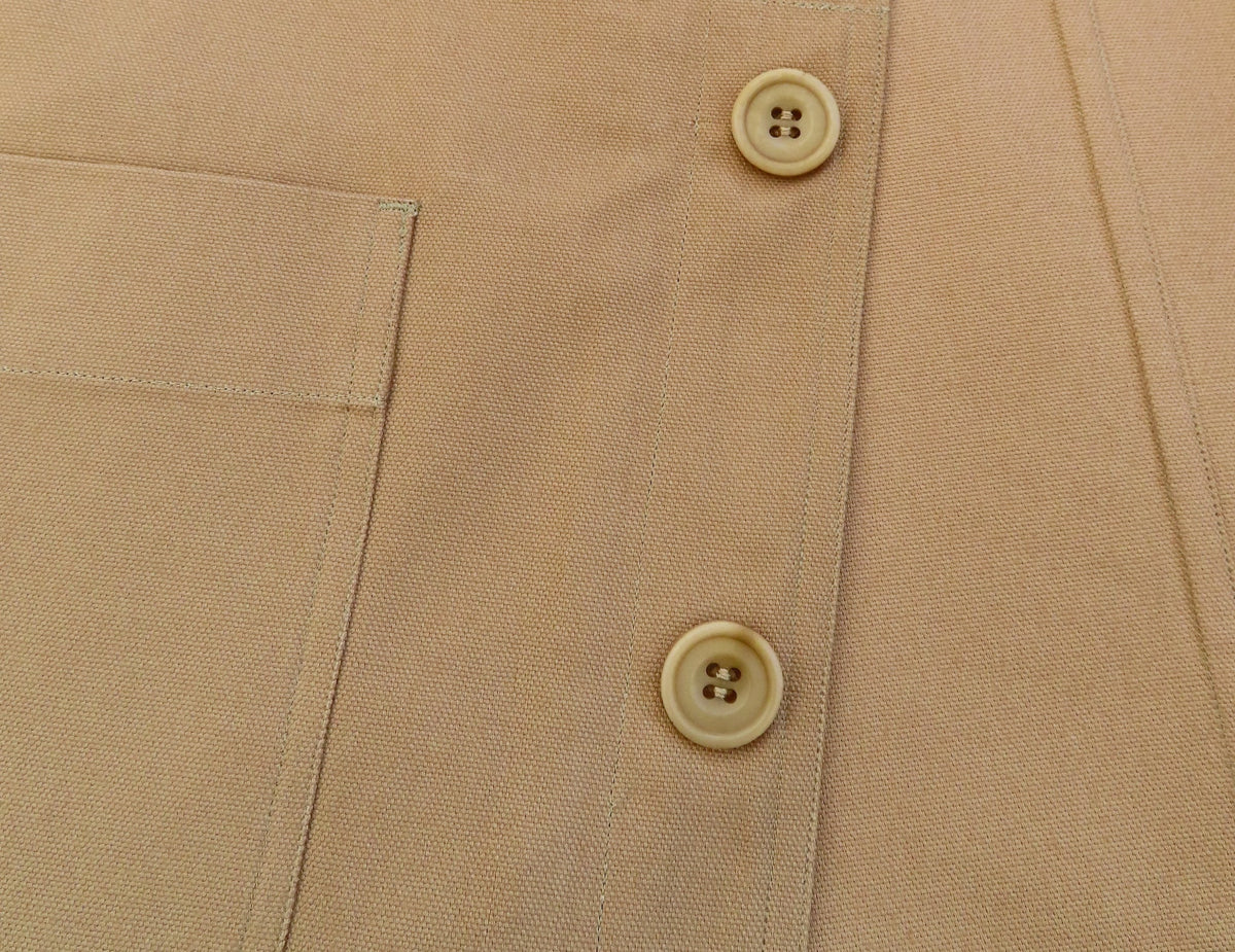 button detail of a tan waistcoat