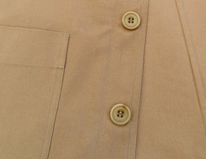 button detail of a tan waistcoat