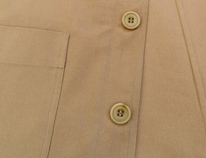 button detail of a tan waistcoat
