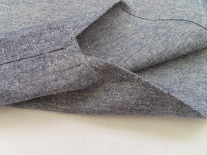 detail of a blue hemp shirt