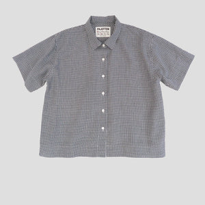 cut out image of awomans  gingham shirt